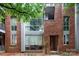 Close-up view of modern brick townhouse with a unique architectural style and multiple large windows at 226 Magnolia Ave, Charlotte, NC 28203
