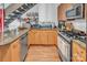 Modern kitchen featuring stainless steel appliances, granite countertops, and ample cabinet space at 226 Magnolia Ave, Charlotte, NC 28203
