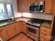 Modern kitchen with stainless steel appliances and wood cabinets at 226 Magnolia Ave, Charlotte, NC 28203
