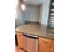 Open concept kitchen with stainless steel dishwasher and wood cabinets at 226 Magnolia Ave, Charlotte, NC 28203
