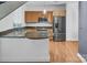 Well-equipped kitchen with stainless steel appliances, granite countertops, gas range, and hardwood floors at 226 Magnolia Ave, Charlotte, NC 28203