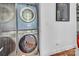 Laundry room featuring a stacked Samsung washer and dryer set and modern minimalist decor at 226 Magnolia Ave, Charlotte, NC 28203