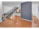Spacious living room features hardwood floors and unique staircase, with modern decor and natural light at 226 Magnolia Ave, Charlotte, NC 28203