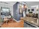 Open living room showcases wood floors, track lighting, and modern art in a neutrally decorated space at 226 Magnolia Ave, Charlotte, NC 28203