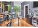 Bright office space with a large window overlooking a green backyard and wood floors at 226 Magnolia Ave, Charlotte, NC 28203