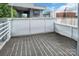 Outdoor patio area with textured flooring and light gray walls surrounded by lush trees at 226 Magnolia Ave, Charlotte, NC 28203