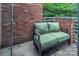 Charming patio area with brick wall and comfortable seating, perfect for relaxation at 226 Magnolia Ave, Charlotte, NC 28203