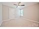 Bedroom featuring a neutral carpet, ceiling fan and natural light at 2506 Glendale Ave, Kannapolis, NC 28081