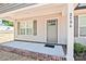 Front porch view highlighting house number, gray siding, and a multi-paneled front door at 2506 Glendale Ave, Kannapolis, NC 28081