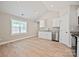 Kitchenette featuring white cabinets and stainless steel appliances at 2506 Glendale Ave, Kannapolis, NC 28081