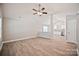 Open-concept living space with laminate floors leading to a bright kitchen area at 2506 Glendale Ave, Kannapolis, NC 28081