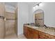 Full bathroom features granite counters, wood cabinets, walk-in shower and updated fixtures at 2617 Bay St, Charlotte, NC 28205