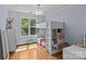 Well-organized bedroom with lofted bed, workspace, and ample natural light from a large window at 2617 Bay St, Charlotte, NC 28205