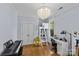 Bright bedroom offers a bed and workspace, complemented by a unique chandelier lighting fixture at 2617 Bay St, Charlotte, NC 28205