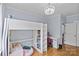 Charming bedroom featuring a unique loft bed with built-in shelving and a study desk area at 2617 Bay St, Charlotte, NC 28205