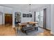 Dining room with a large wooden table, bench seating, and ample natural light at 2617 Bay St, Charlotte, NC 28205