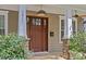 Close-up of the front door featuring stylish fixtures, and stone accents on a welcoming front porch at 2617 Bay St, Charlotte, NC 28205
