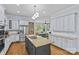 Large kitchen with stainless steel appliances, granite countertops, and island seating at 2617 Bay St, Charlotte, NC 28205
