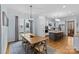 Open kitchen and dining area with stainless steel appliances and a kitchen island with bar seating at 2617 Bay St, Charlotte, NC 28205
