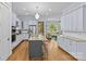 Spacious kitchen with granite countertops, stainless steel appliances, and a view into the living room at 2617 Bay St, Charlotte, NC 28205
