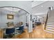 Open-concept layout with hardwood floors connecting the living room, dining area, and modern kitchen at 2617 Bay St, Charlotte, NC 28205