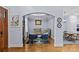 View of living room with an arched opening leading to dining and kitchen areas at 2617 Bay St, Charlotte, NC 28205