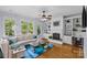 Cozy living room with a fireplace, built-in bookshelves, and plenty of natural light at 2617 Bay St, Charlotte, NC 28205