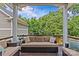 Covered porch with outdoor furniture and string lights, providing a cozy atmosphere at 2617 Bay St, Charlotte, NC 28205