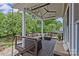 Covered porch with outdoor seating area offering a comfortable and relaxing space to unwind at 2617 Bay St, Charlotte, NC 28205