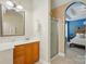 Bathroom featuring a wood cabinet and a tiled shower at 2745 Stockwood Dr, Gastonia, NC 28056