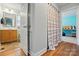 Bathroom with a wood cabinet and views into the bedroom at 2745 Stockwood Dr, Gastonia, NC 28056