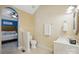 Bathroom featuring a tiled floor, toilet, and modern sink at 2745 Stockwood Dr, Gastonia, NC 28056