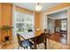 Bright dining room featuring neutral walls, tile flooring, and a garden view at 2745 Stockwood Dr, Gastonia, NC 28056