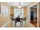 Inviting dining room with natural light, simple decor, and seating for four at 2745 Stockwood Dr, Gastonia, NC 28056