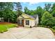 Charming home with a spacious driveway surrounded by mature trees and greenery at 2745 Stockwood Dr, Gastonia, NC 28056