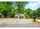 Cozy home with landscaped front yard, surrounded by mature trees at 2745 Stockwood Dr, Gastonia, NC 28056