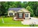 Charming home with well-maintained lawn and landscaping in a serene, wooded setting at 2745 Stockwood Dr, Gastonia, NC 28056