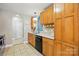 Bright kitchen featuring wood cabinets, light countertops, and a convenient layout at 2745 Stockwood Dr, Gastonia, NC 28056