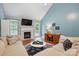 Cozy living room featuring a fireplace, TV, neutral sectional sofa, and stylish decor at 2745 Stockwood Dr, Gastonia, NC 28056