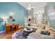 Bright living room featuring a large sectional sofa, stylish decor, and a cozy desk area at 2745 Stockwood Dr, Gastonia, NC 28056