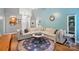 Spacious living room featuring a large sectional sofa, round rug, and stylish decor at 2745 Stockwood Dr, Gastonia, NC 28056