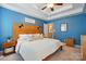 This main bedroom has modern decor, a ceiling fan, and an ensuite bathroom at 2745 Stockwood Dr, Gastonia, NC 28056