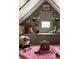 Charming attic space with a cozy window seat and playful decor, perfect for a playroom at 290 Union S St, Concord, NC 28025