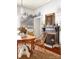 Cozy dining room with a fireplace, chandelier, and unique artwork, creating an inviting atmosphere at 290 Union S St, Concord, NC 28025