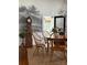 Elegant dining area showcasing a rustic grandfather clock and stylish wooden chairs under a modern chandelier at 290 Union S St, Concord, NC 28025