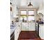 Bright kitchen featuring white cabinetry, granite countertops, and stainless steel appliances for a modern touch at 290 Union S St, Concord, NC 28025