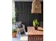 Relaxing outdoor seating area with comfortable wicker chairs and charming decor at 290 Union S St, Concord, NC 28025