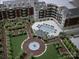 Aerial view of the condos featuring a pool, walking paths, a gazebo and manicured gardens at 300 W 5Th St # 404, Charlotte, NC 28202