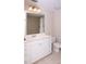 Bright bathroom featuring a vanity with drawers, a large mirror, toilet, and shower at 300 W 5Th St # 404, Charlotte, NC 28202