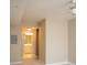 Bright room with a ceiling fan, neutral walls, and a glimpse into the ensuite bathroom at 300 W 5Th St # 404, Charlotte, NC 28202